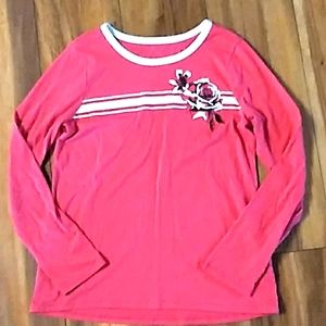 Pink long sleeve Justice shirt.